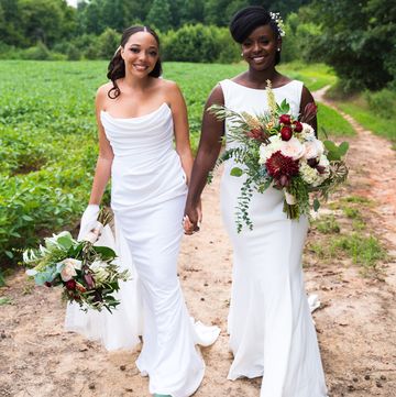 the author and her wife at their wedding holding hands