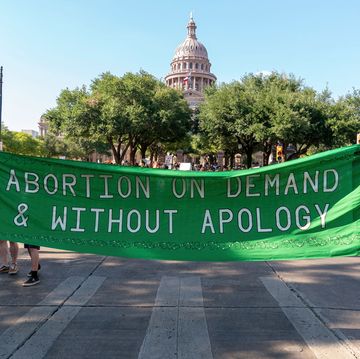 a protest banner that reads abortion on demand and without apology