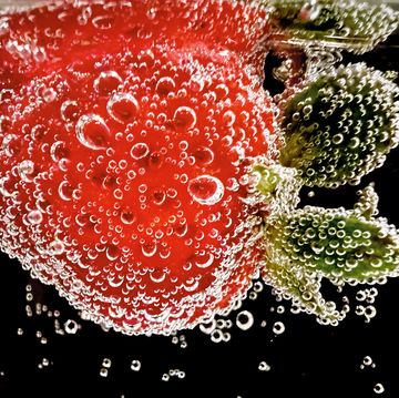 strawberry submerged in soda