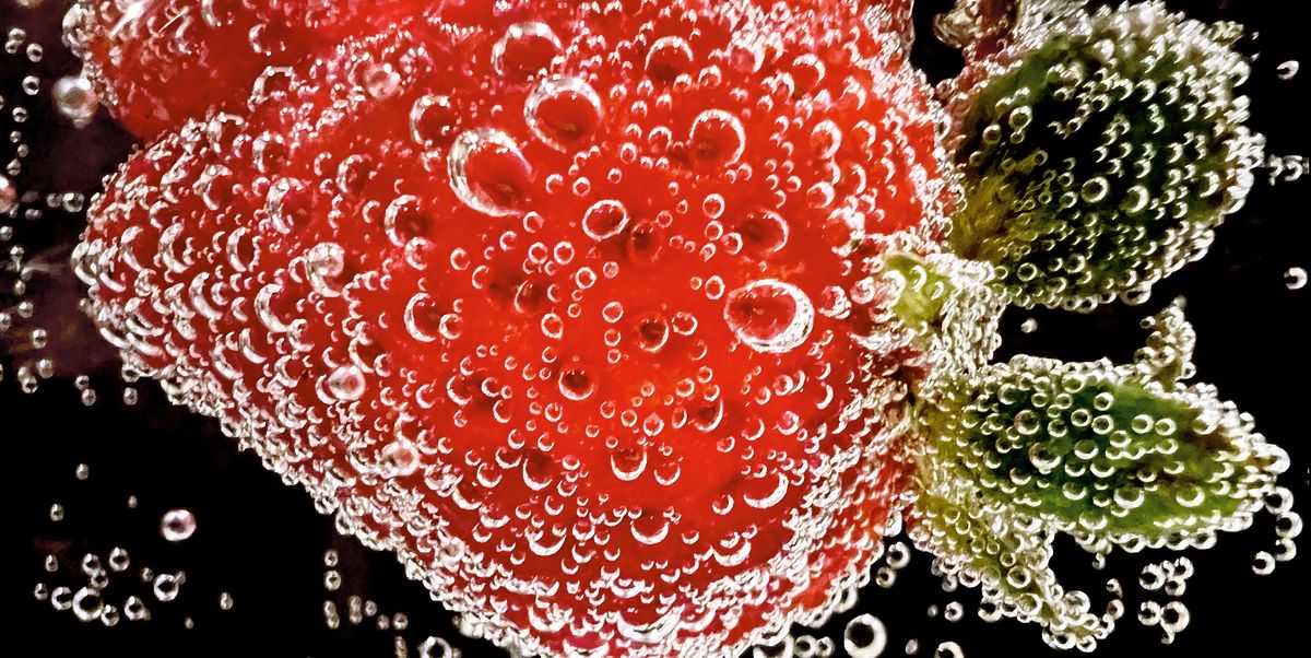 strawberry submerged in soda