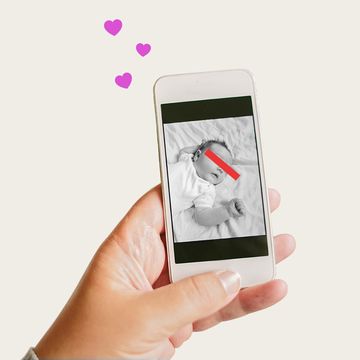 woman holding phone with baby picture woman holding phone with baby picture