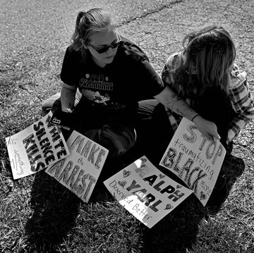 mother and daughter sit outside the house where 16 year old ralph yarl was shot several days earlier when he went to the wrong address to pick up his brothers