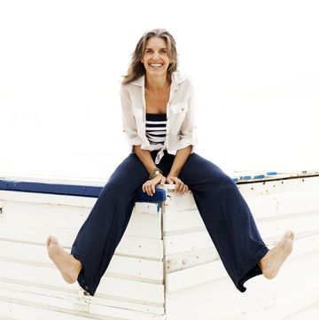 Woman In Blue Pants Smiling woman in blue pants smiling